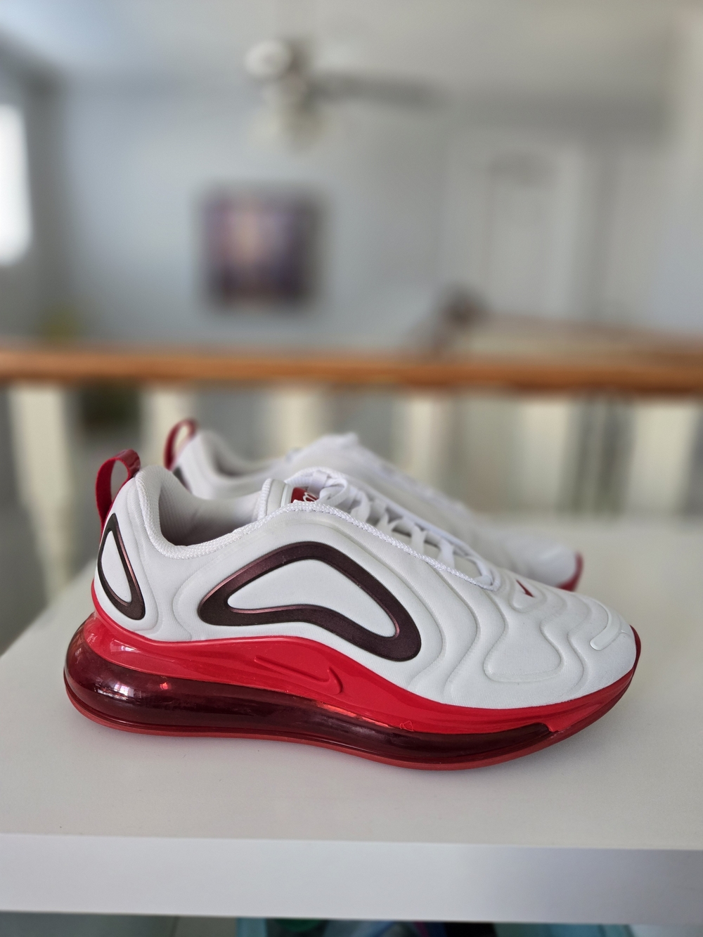 Nike Air Max 720 sneakers in white with red sole and black swoosh, size US 7.5